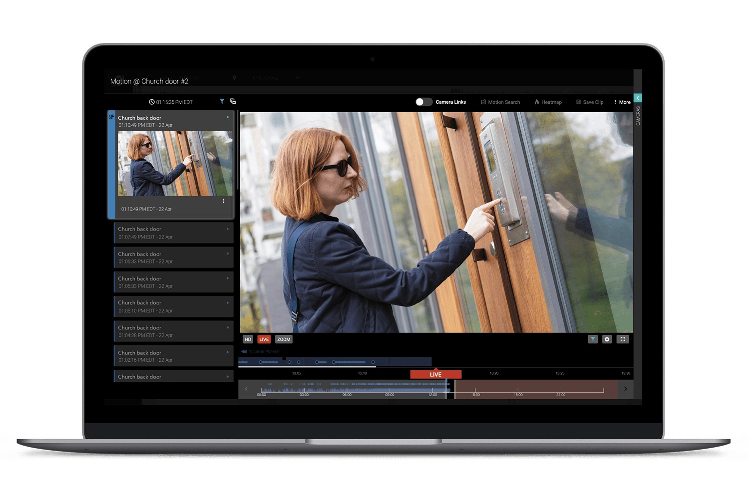 A laptop with a woman's face on the screen.